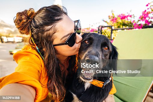 istock Young Woman Takes Selfie With Her Dog 1432914188