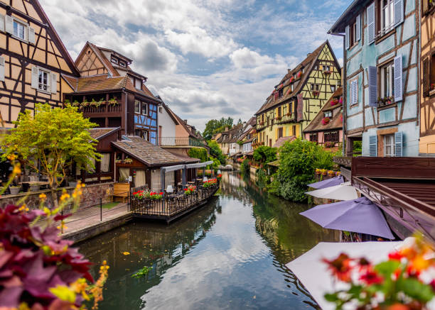 Colmar city in France. Street view with old buildings in Colmar. Old colorful houses Colmar city in France. Street view with old buildings in Colmar. Old colorful houses colmar stock pictures, royalty-free photos & images