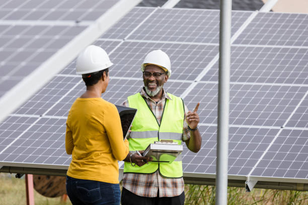 istock Male safety inspector meets with solar panel employee 1432919466