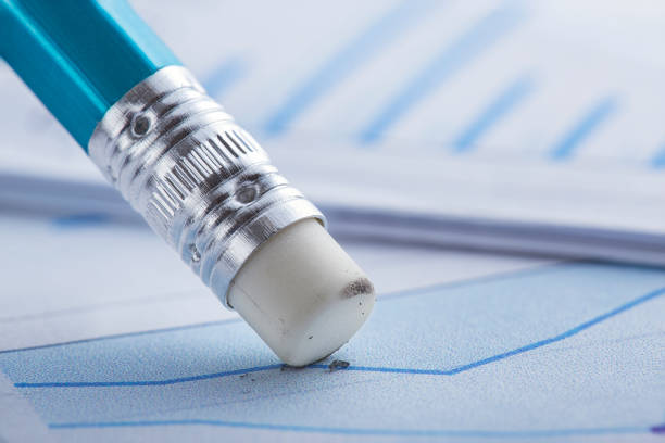istock Accounting document with eraser erases blots in the document and checking financial chart. Concept of banking, financial report and financial audit. 1432921326