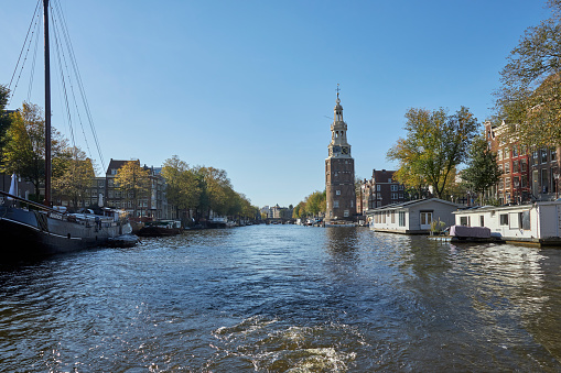 The Montelbaanstoren old city tower at Oudeschans canal in Amsterdam, The Netherlands
