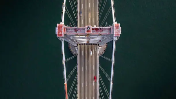 High quality stock aerial photos looking down at early morning traffic on the San Francisco Bay Bridge.