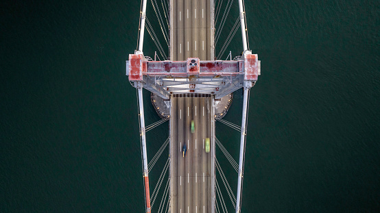 High quality stock aerial photos looking down at early morning traffic on the San Francisco Bay Bridge.