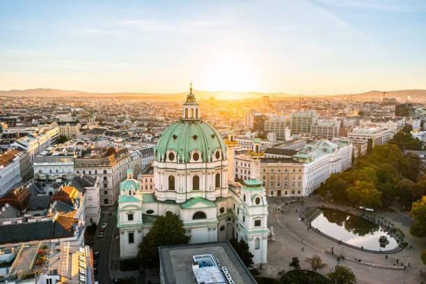 Aerial Drone Photo - St. Charles Church "Karlskirche" at sunset. Vienna, Austria Beautiful Karlskirche Church.  Vienna austrian culture stock pictures, royalty-free photos & images