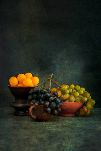 istock Still life with ripe grapes and orange balls 1432923368