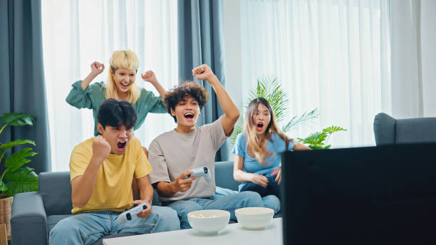 istock group of friends having fun together while playing games 1432925020