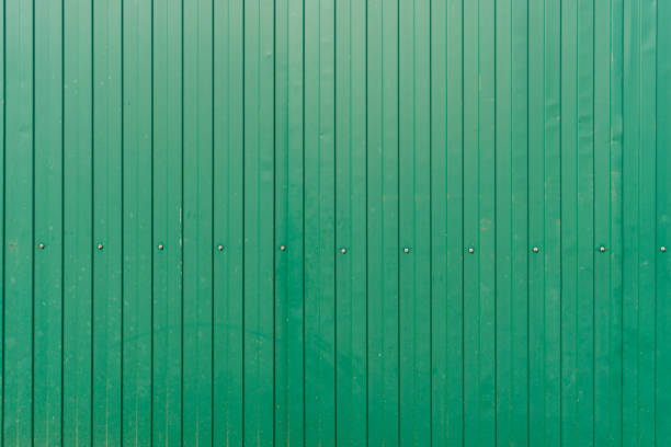 istock Green metal surface. Texture. Fence with rivets close-up 1432925160