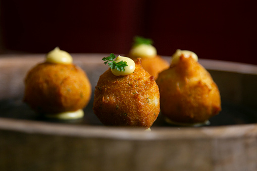 Tapa of cod fritters. Bechamel balls with fried cod.