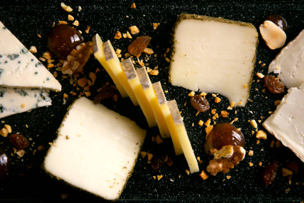 istock Assorted cheese platter. Traditional spanish tapa with manchego cheese, gorgonzola, goat cheese, cured cheese. 1432926087