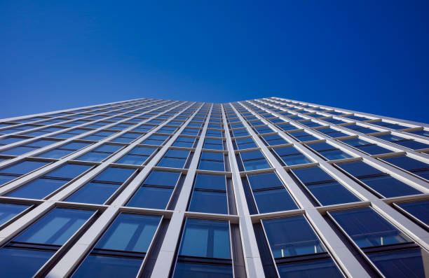 istock looking up to modern high rise office building 1432926801