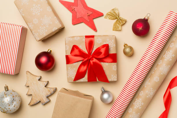 istock Gift boxes, paper's rools and decorations on color background, top view 1432926898