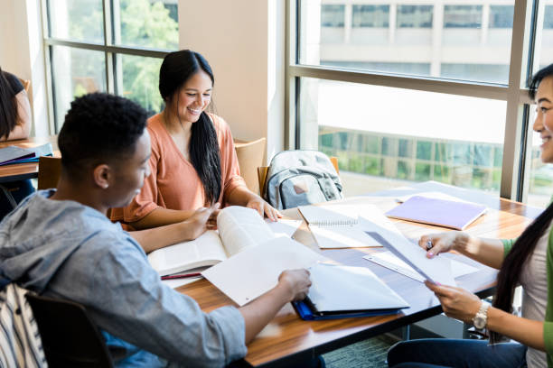 istock Diverse college students meet with teacher to brainstorm 1432927576