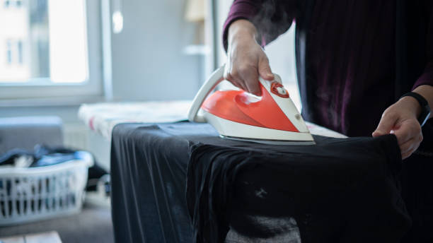 istock Close-up Woman Ironing Shirt 1432927719