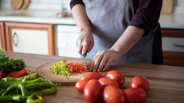 istock Close-up woman chopping vegetables 1432927813