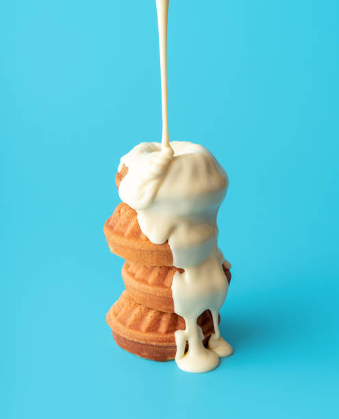 istock Mini bundt cake covered in white chocolate. Pouring melted chocolate 1432929472