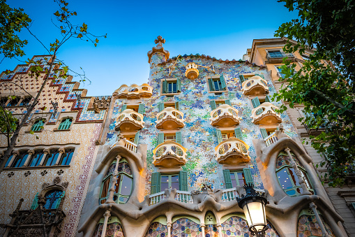 BARCELONA, SPAIN - JULY 20, 2022: Facade of Casa del Batllo designed by Antoni Gaudi in city center of Barcelona at dusk, Catalonia, Spain, Europe.