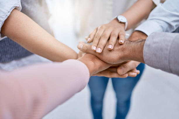 istock Diversity, teamwork hands or community goal for success vision, innovation or motivation with business people, men or women. Zoom closeup of global collaboration workers group in support trust circle 1432932892
