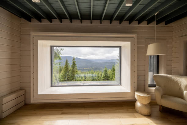 istock Wooden house interior with panoramic window and scenic view on the mountains 1432934968