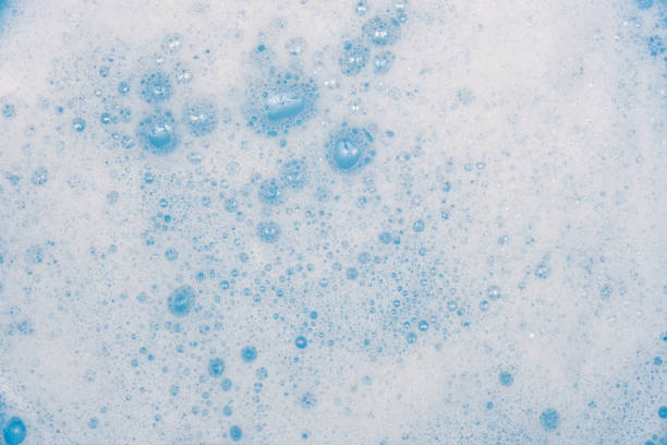 istock Washing detergent foam with bubbles close up background 1432934994