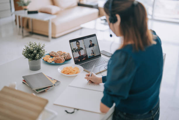 istock Chinese Woman with disability deformed arm work from home video call at kitchen counter business meeting virtual event 1432937354
