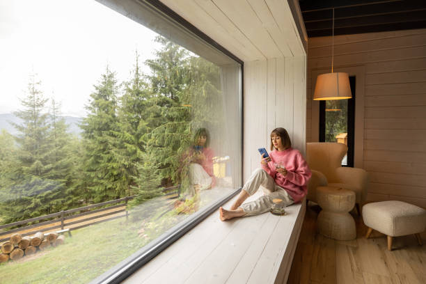 istock Woman rests in house with scenic view on mountains 1432937421
