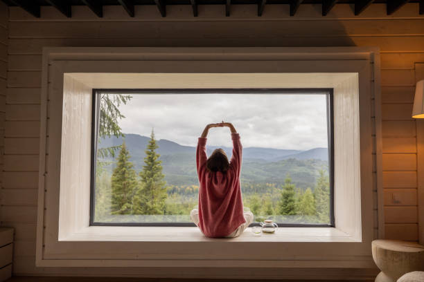 istock Woman rests in house at mountains 1432937532