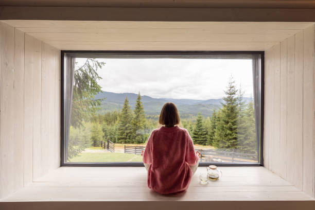 istock Woman rests in house at mountains 1432937560