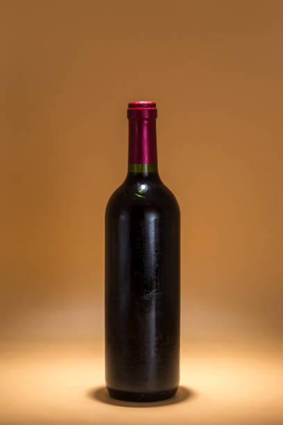 istock bottle of red wine on a brown background, warmth 1432942666