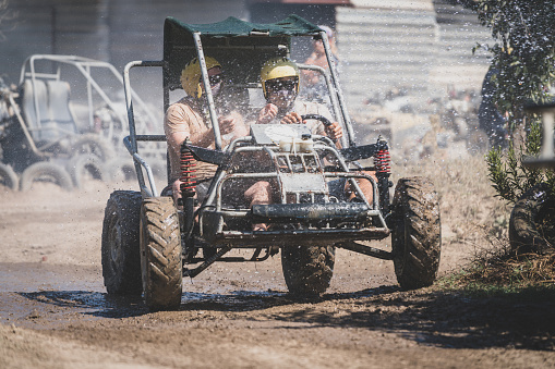 Racing in the sand on a four-wheel drive quad.