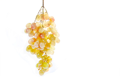 bunch of light grapes on white background - isolated - delicious sweet chardonnay grapes or other variety and copy space