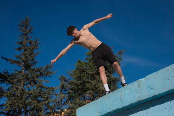 istock young guy doing parkour in the urban area 1432948028