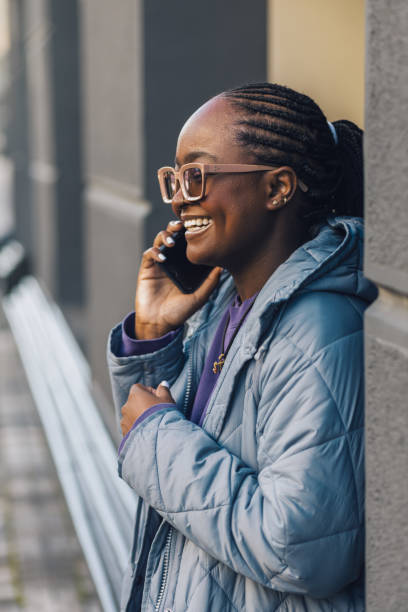 istock Beautiful young black woman having a phone call 1432948292