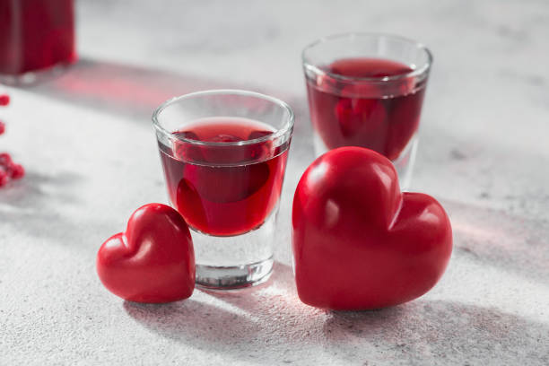 istock Red cocktail, vodka or liqueur and Heart shape decorations 1432953942