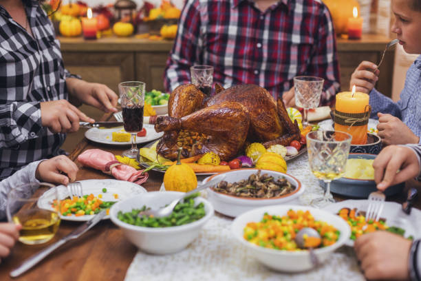 istock Family having traditional thanksgiving dinner at home 1432953960