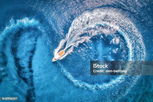 Aerial View Of The Speed Boat In Transparent Blue Water At Sunset In Summer Top View From Drone Of Fast Floating Yacht In Mediterranean Sea Tropical Colorful Landscape With Motorboat Extreme Stock Photo - Download Image Now