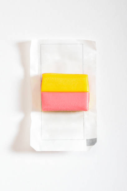 Open package bubble gum, multi colored chewing gum on the white background