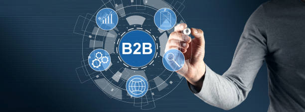 istock B2B and icons on a virtual screen. Man drawing with a marker 1432973665