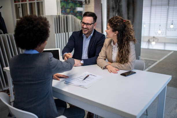 istock Young business couple signing a contract 1432977371