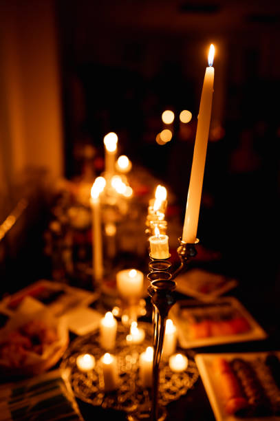 istock table with burning candles and food 1432981544