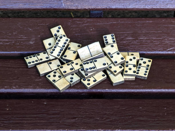 istock Dominoes pieces lying on a bench 1432983945