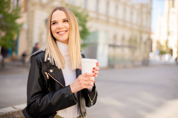 istock Young woman smiling at sunset 1432986686