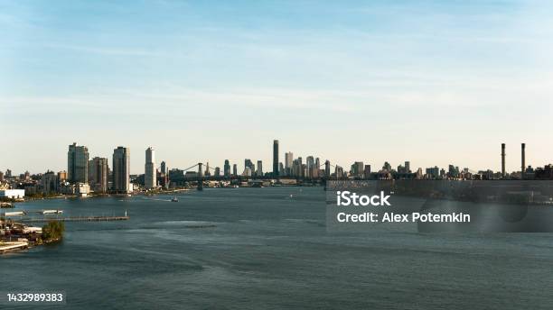 East River View With Williamsburg Bridge Over The River With Manhattan And Williamsburg Brooklyn At The Distance Stock Photo - Download Image Now
