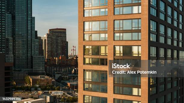 New Residential Building In Hunters Point Queens With The View Of The Smokestacks Of Power Plant In Astoria Queens In The Backdrop Stock Photo - Download Image Now