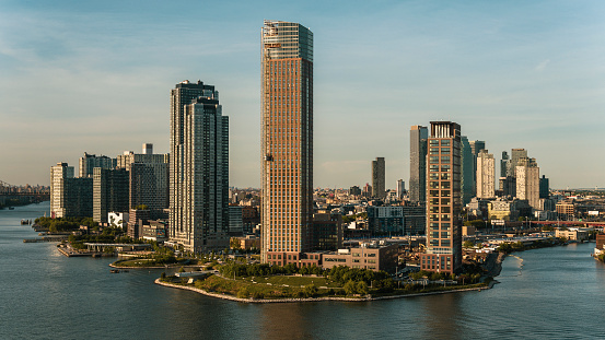 Luxury apartments in Hunter's Point South phase 2 overlooking the East River with Long Island City towers behind.