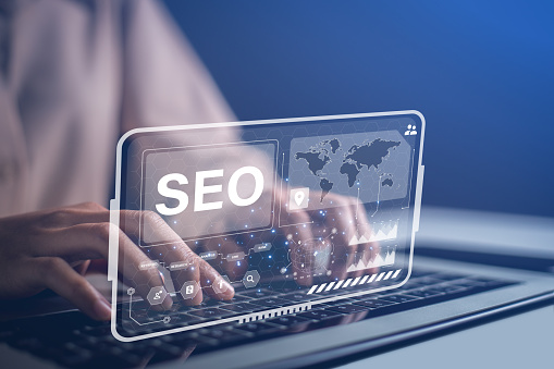 Admins using laptops to manage their site improvement tools to provide better search results and boost website traffic rankings. Optimizing website for search engine rankings with SEO tool.