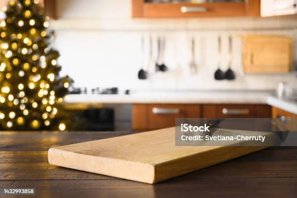 https://media.istockphoto.com/id/1432993858/photo/wooden-tabletop-with-cutting-board-and-blurred-kitchen-with-christmas-tree-background-for.jpg?s=612x612&w=is&k=20&c=4pwesQeFsp-WVKangfznpk9jOEZqAuxns6M5nhZb1ho=