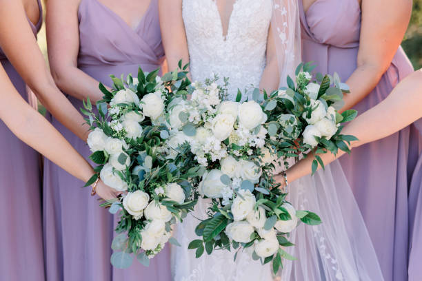 istock Bride and Bridesmaids holding flower bouquets 1433001548