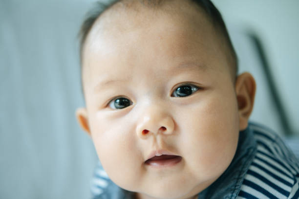 istock A newborn baby who opens his eyes and looks forward 1433004632
