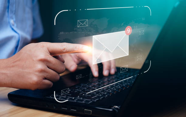 istock email marketing concept. Businessman using tablet surfing internet on desk with email icon, electronic mail, e-commerce. newsletter email and protect your personal information from spam mail 1433005522