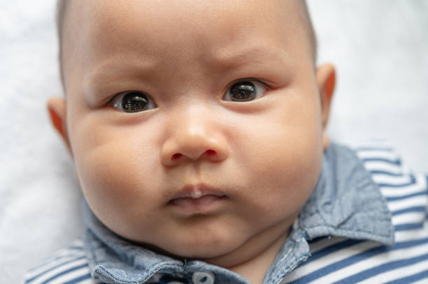 istock A newborn baby who opens his eyes and looks forward 1433006156